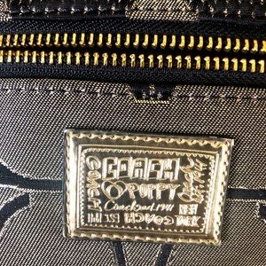 SOLD. Coach Poppy Secret admire